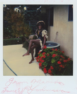 A Photograph of Marsha P. Johnson Posed on an AC Unit