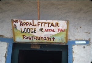 Sign for lodge and food, near Japanese hotel
