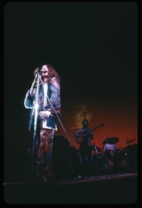 Janis Joplin, performing at Woodstock, with John Till (guitar) in background