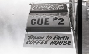Front entrance to McCue 2 pool hall: close-up of sign for Cue #2 and Down to Earth Coffeehouse