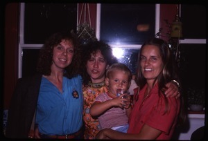 Karen Guilette, Martha Miller, Elaine Maxwell (holding infant Max) in the living room, Montague Farm Commune