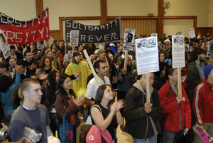 UMass student strike: strikers in the Student Union ballroom holding signs supporting a general student strike and 'Solidarity forever'