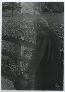 W. E. B. Du Bois walking next to a fence in Switzerland