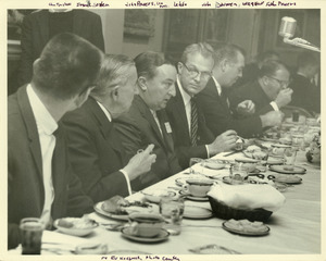 John W. Lederle seated at a function with Frank Boyden, John Powers, John Donovan, and Fr. Powers.