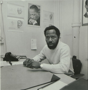 Dr. O.C. Bobby Daniels sitting indoors, behind desk