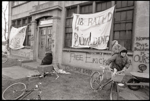Women's occupation of the Architectural Technology Workshop, Harvard University: children and bicycles outside graffiti-covered ATW