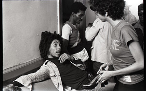 Bob Marley and the Wailers at Paul's Mall: Marley backstage speaking with a woman, in background Carlton Barrett, Aston Barrett, and Joe Higgs