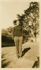 Leon M. Smith standing outside
