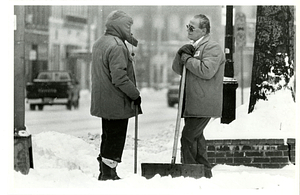 Paul Golden and Rico Silva talking during snowstorm