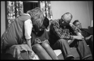 Peggy Loving seated on the arm of a couch with (from left) her parents Mildred and Richard Loving and grandfather