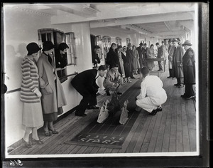 Crowd playing the horses on promenade deck of the St. John steamship