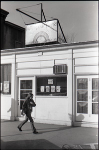 Woman walking past the Free Spirit Press office