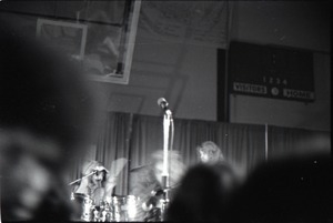 Jethro Tull in concert at the Springfield Civic Center: blurry shot of heads of audience and band behind