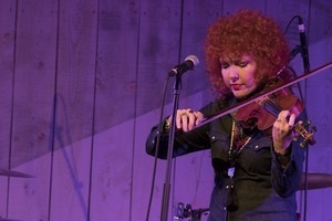 Eleanor Whitmore (fiddle) performing onstage with Steve Earle and the Dukes at the Payomet Performing Arts Center