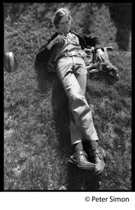 Livingston Taylor, lying on the lawn with a puppy, smoking a cigarette