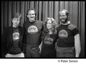 Musicians United for Safe Energy concert performers: Graham Nash, James Taylor, Bonnie Raitt, and John Hall (l. to r.) wearing MUSE tee-shirts