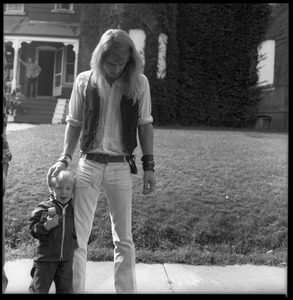 Michael Metlica and young boy in front of the Brotherhood of the Spirit commune house on Chestnut Street, Turners Falls