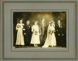 Polish American bride, groom, and bridal party: full-length studio portrait