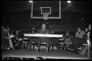 Oswald Tippo (Provost, UMass Amherst) speaks at open meeting with school administration, Curry Hicks Cage, regarding protests against war in Vietnam