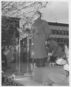 Unidentified male addresses crowd