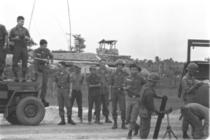 Army of the Republic of Vietnam soldiers on maneuvers in front of Nhi Tan outpost; Gia Dinh Province.