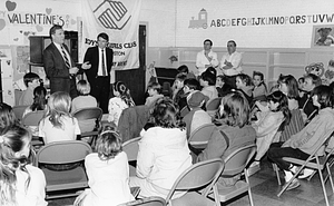 Mayor Raymond L. Flynn and Police Commissioner Francis "Mickey" Roache speaking to group of children of the Boys and Girls Club