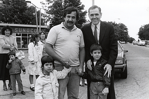 Mayor Raymond L. Flynn in Roslindale with City of Boston employee James Bichekas, Stella and Peter Bichekas, with Dimitra Bichekas and others looking on