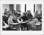 Members of Suffolk University's College of Arts and Sciences (CAS) faculty meet in a classroom, photograph, 1981