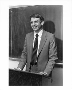 Suffolk University Professor Alvan Brody (Law), behind podium in a classroom
