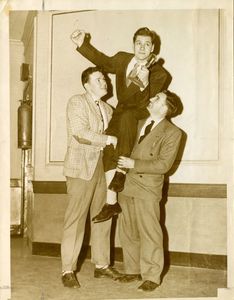 Dick Stukas celebrates with two classmates after winning the Suffolk University Law School oratorial contest