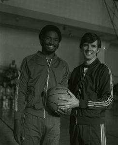 Suffolk University men's basketball coach James E. Nelson with a player, 1979-1980