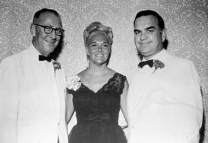John Joseph Moakley, Evelyn Moakley and unidentified man at social event, 1960s