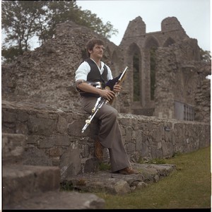 Gerry McFadden, Belfast piper, playing at Inch Abbey, Downpatrick