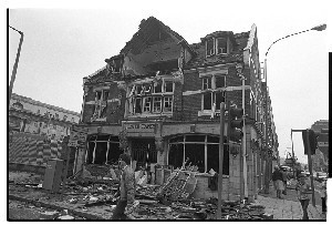 Ulster Tavern Pub, Chichester Street, Belfast. PIRA attack. Pub and other buildings, including the Law Courts, were badly damaged by a car bomb. Shots taken just after the bomb blast. Some include remains of the car used in the attack