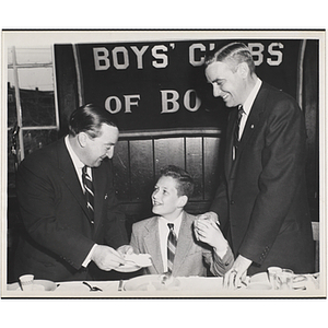 State Senator John E. Powers, on the left, and an unidentified man serving a boy at a Boys' Clubs of Boston awards event