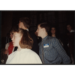 A girl and two boys looking off to their right during the "Recognition Dinner at Harvard Club"