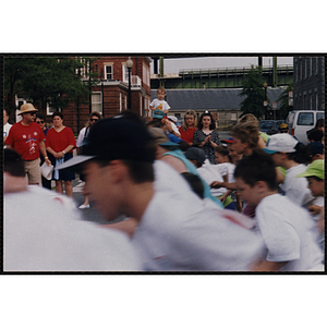 Children run in the Bunker Hill Road Race as spectators look on