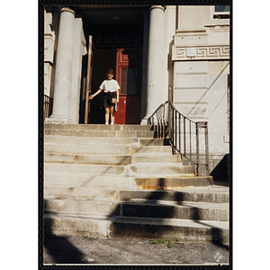 A Girl exiting the front door at the Clarence R. Edwards Middle School