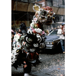 Costumed performer demonstrates the dragon dance during a celebration of the Chinese New Year in Boston's Chinatown