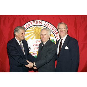 John A. Curry (left), Robert Shillman (center), and George J. Matthews (right) at a Board of Trustees meeting