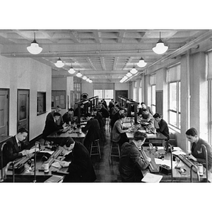 Male students work in a physics laboratory