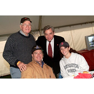 President Freeland poses with members of the NU community during Homecoming festivities