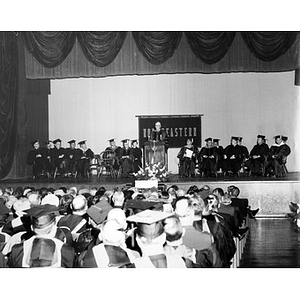 Faculty and administrators on stage at commencement, 1965