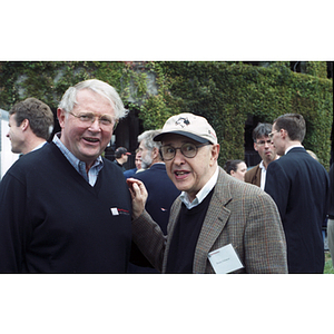 Neal F. Finnegan and Bernard "Bunny" Solomon pose together at a Harvard football game