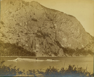 Two men seated on rocks, Moosehead Lake, Maine, undated
