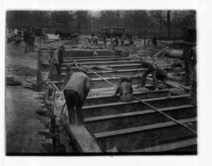 Workers and steel beams on the Common