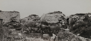 View of damaged stone fortifications on the side of the Yser [IJzer] river that was held by the Germans
