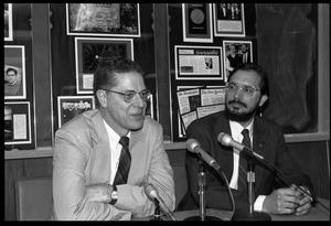 Russell A. Hulse (right) and Joseph H. Taylor: seated at a microphone at a press conference at UMass Amherst following receipt of the Nobel Prize in Physics