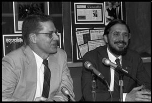 Russell A. Hulse (right) and Joseph H. Taylor: seated at a microphone at a press conference at UMass Amherst following receipt of the Nobel Prize in Physics