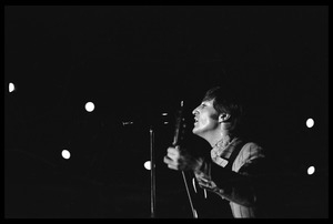 John Lennon (the Beatles) playing guitar and singing in concert at D.C. Stadium